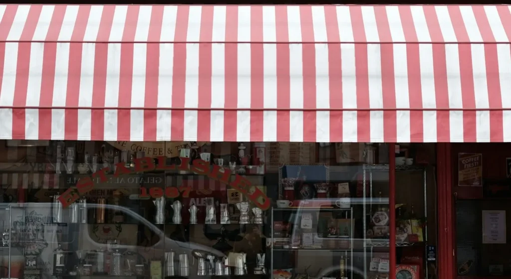 Clean red and white striped awning (after)